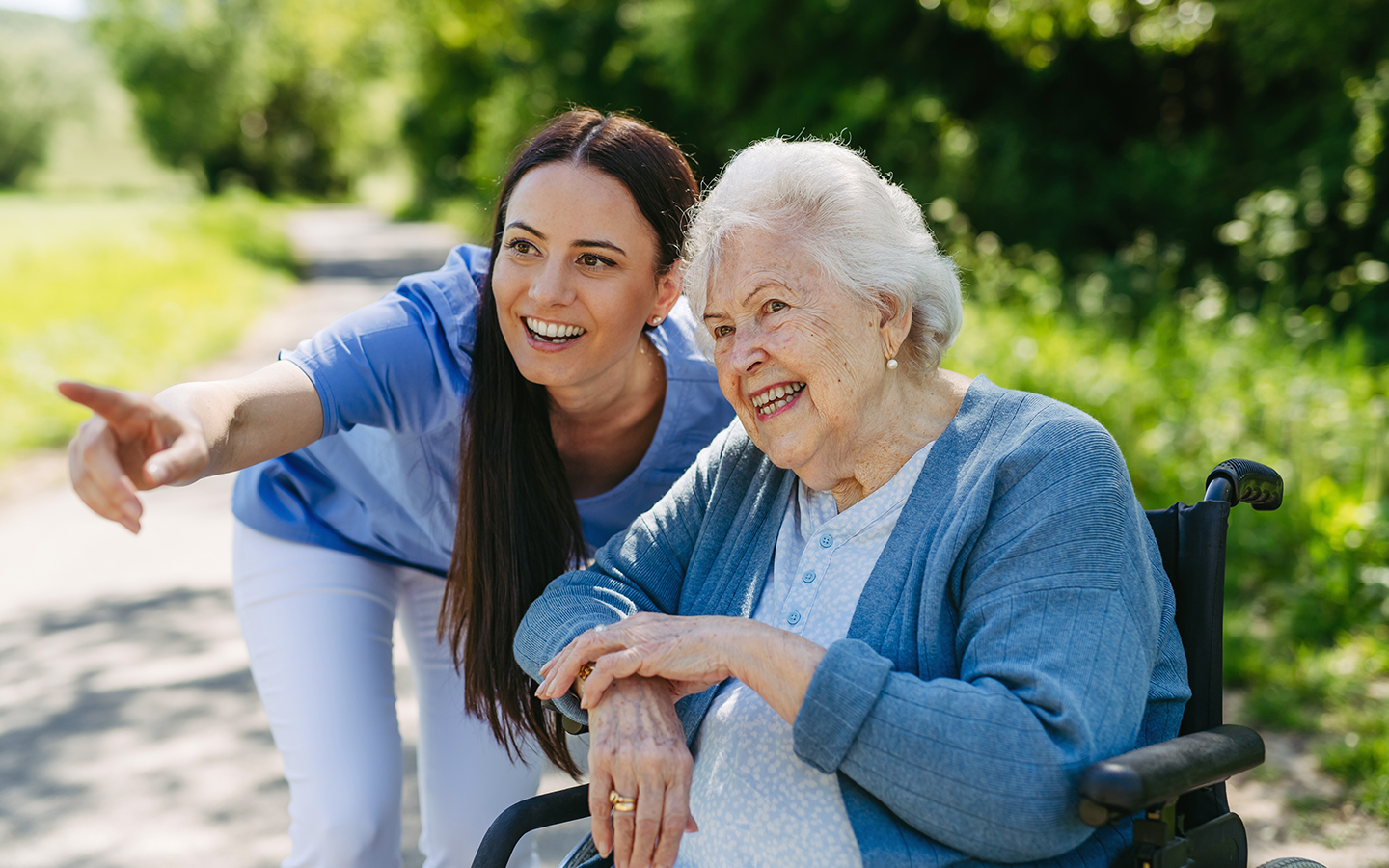 Caregiver assisting elderly patient